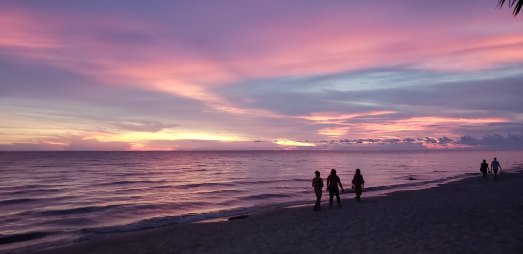 Friends and sunset on White Sands Beach,  Koh Chang. "Friendship feeds the soul". reconnecting with friends is an important part of the celebration of the first year with baby.